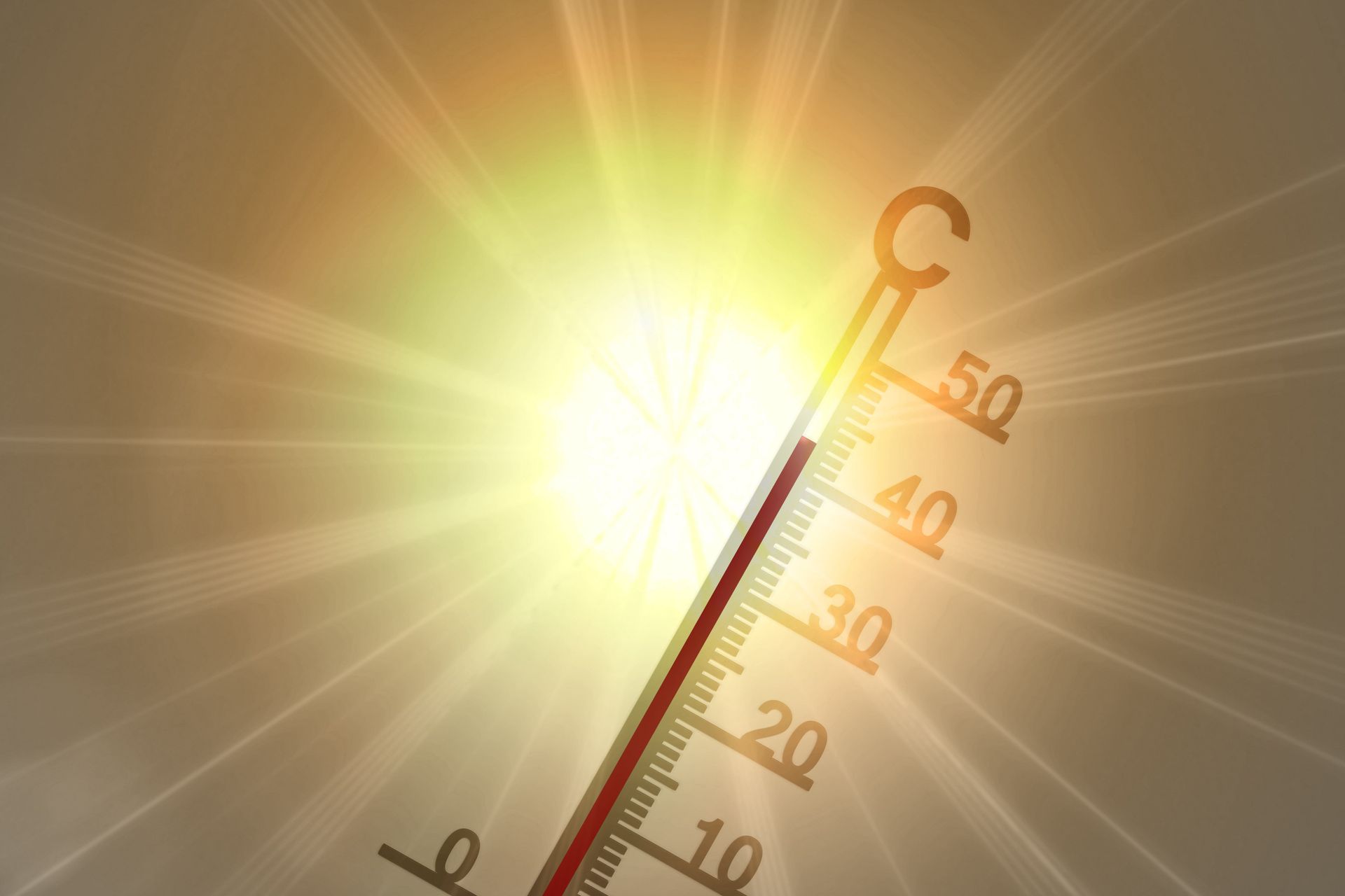 Sonne im Hintergrund, davor ein Thermometer, das eine hohe Grad-Anzahl zeigt.