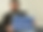 Martin Schäfer, Erster Bürgermeister der Gemeinde, hält die eingerahmte Auszeichnung sitzend in den Händen
